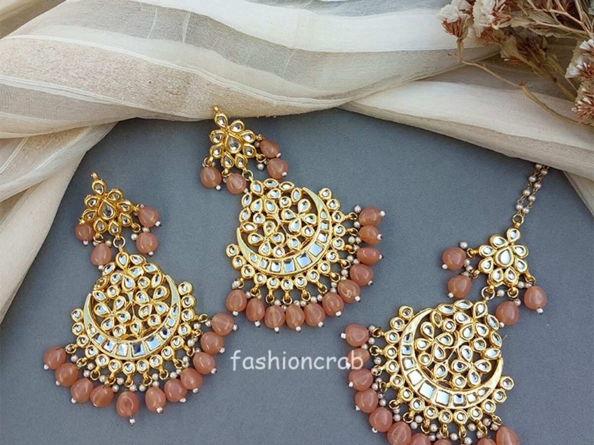 Maroon colour jhumka earrings and tikka set with pipal Patti in tradit –  Timeless desires collection